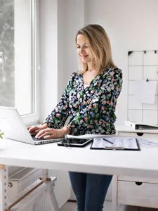 Woman working at standing desk