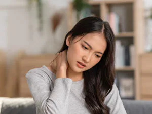 Woman holding neck