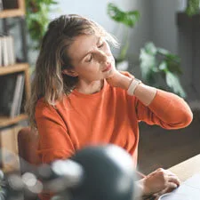 woman experiencing neck tension