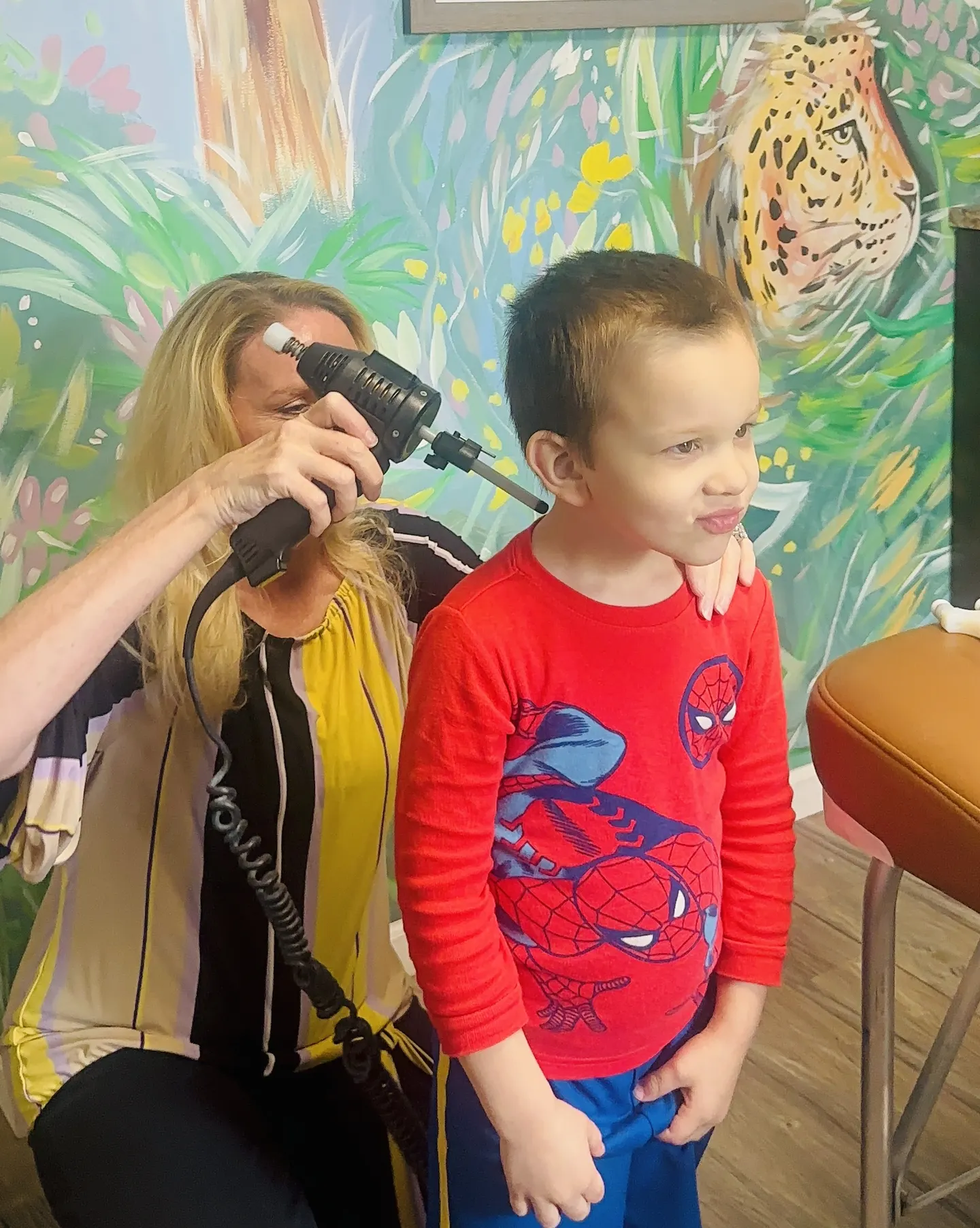 Dr. Anna Saylor giving a young boy a gentle adjustment in our Royal Oak office