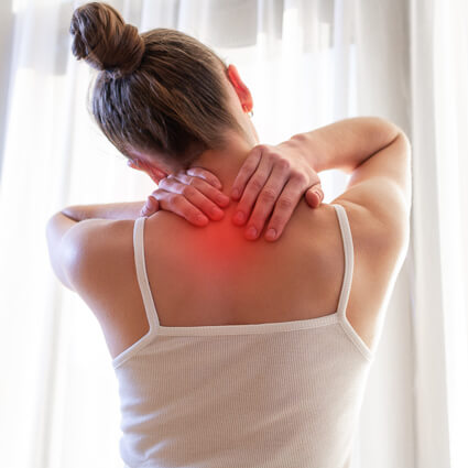 Woman with her hands on the back of her neck