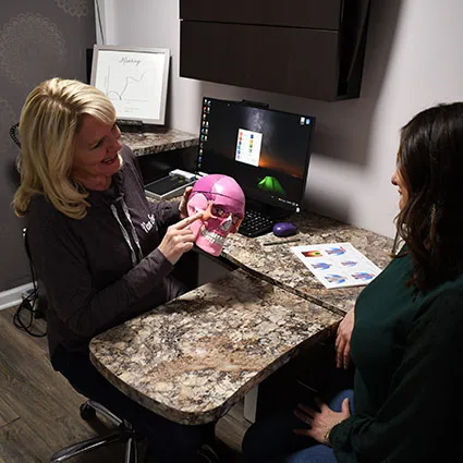 Dr. Anna Saylor explaining spine and skull anatomy